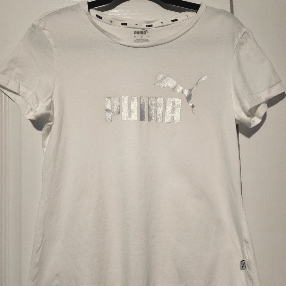 White short sleeve top with silver Puma decal. Size L